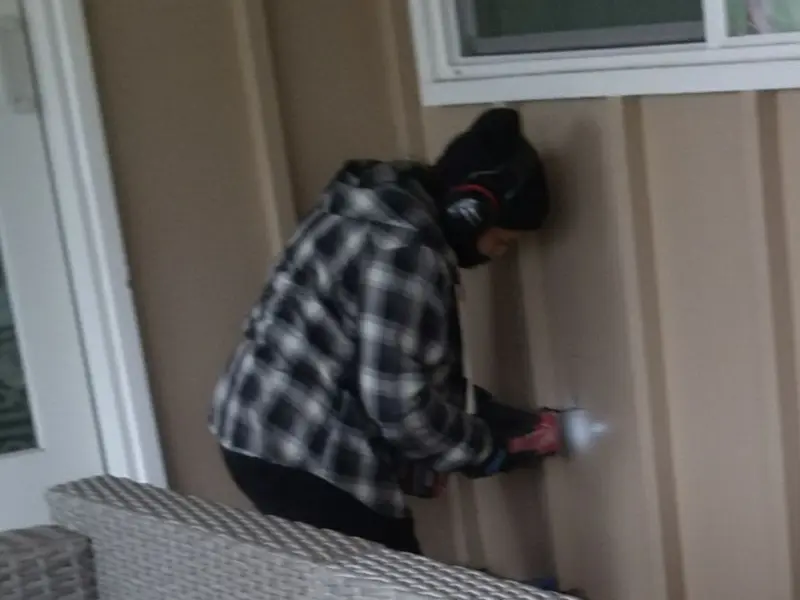 Professional electrician installing an exterior outlet in Springboro
