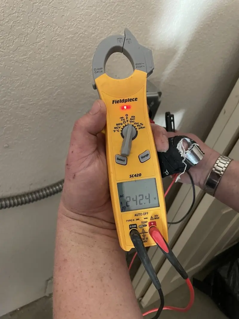 Voltage testing with clamp meter during Circuit Breaker Repair in Springboro